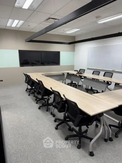 Modern office meeting room with sleek design and ample seating