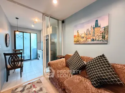 Cozy living room with plush sofa and dining area in modern apartment