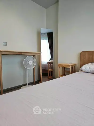Cozy bedroom with minimalist decor and natural light