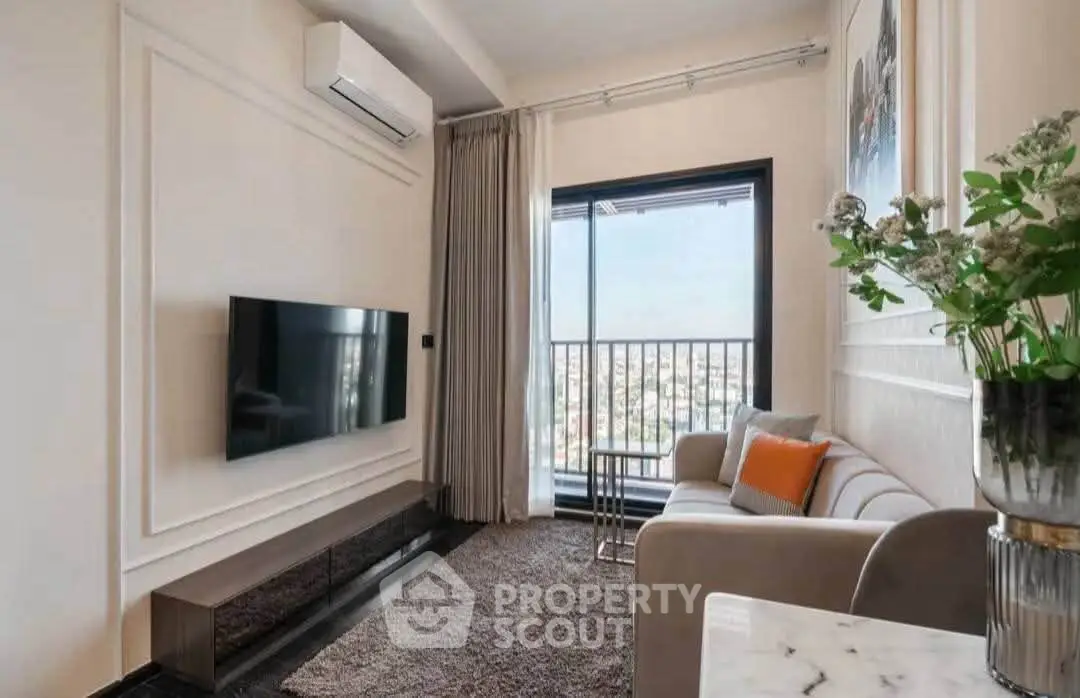 Modern living room with city view, featuring sleek TV setup and cozy seating area.