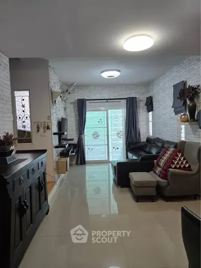 Spacious living room with modern decor and natural light