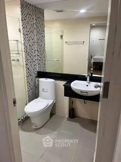 Modern bathroom with sleek fixtures and stylish tile accents