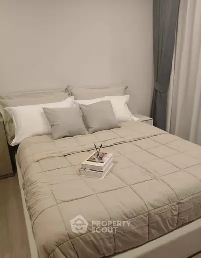 Cozy bedroom with neutral tones and stylish decor, perfect for relaxation and comfort.