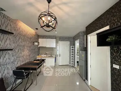 Modern kitchen and dining area with stylish lighting and sleek design