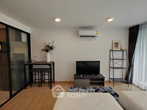 Modern living room with sleek furniture and air conditioning