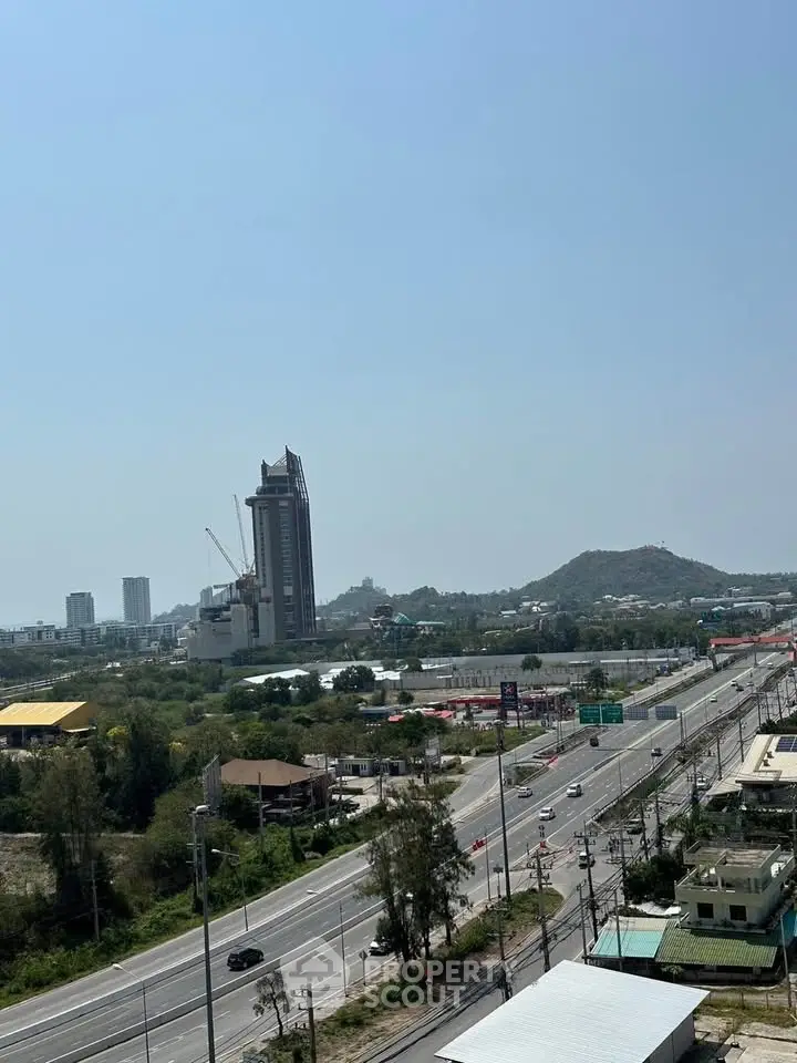 Stunning cityscape view with modern buildings and lush greenery, perfect for urban living.