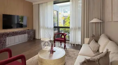 Elegant living room with modern decor and large windows for natural light