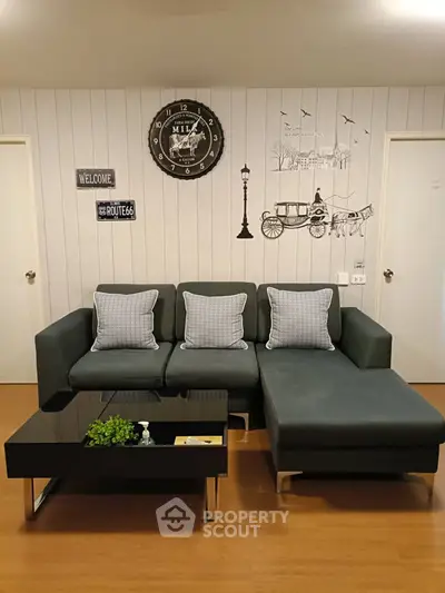 Stylish living room with modern sofa and chic wall decor