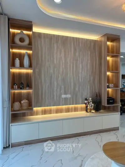 Modern living room with elegant built-in shelving and ambient lighting