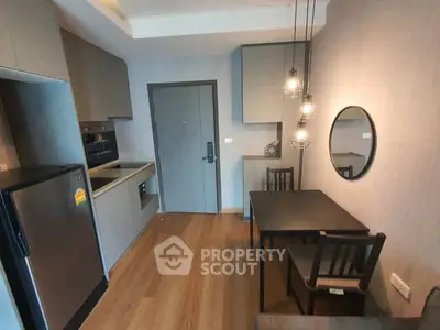 Modern compact kitchen with dining area in stylish apartment
