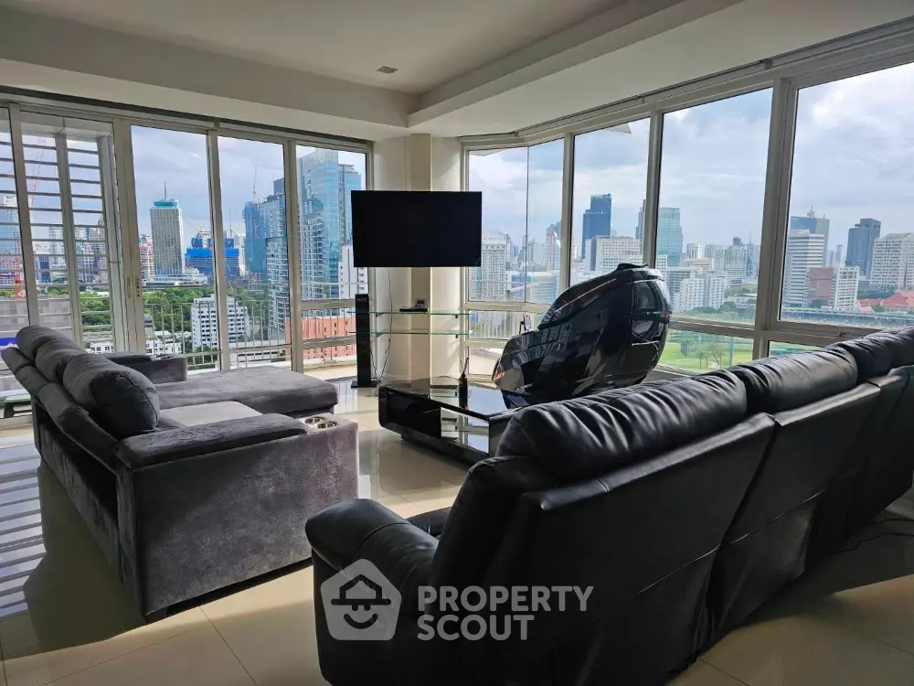 Luxurious living room with panoramic city views and modern furnishings