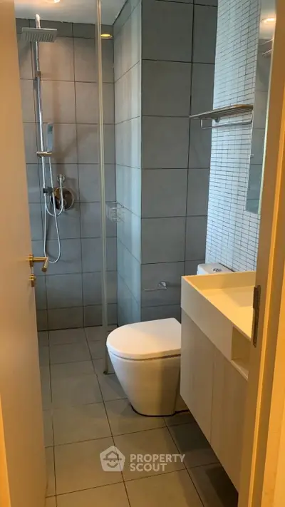 Modern bathroom with sleek fixtures and minimalist design in a contemporary apartment.