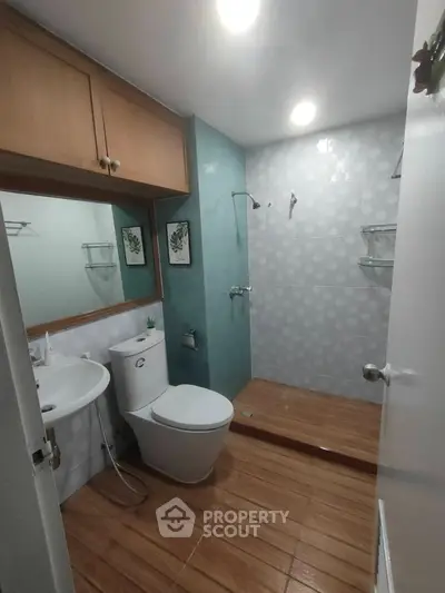 Modern bathroom with sleek design and wooden flooring