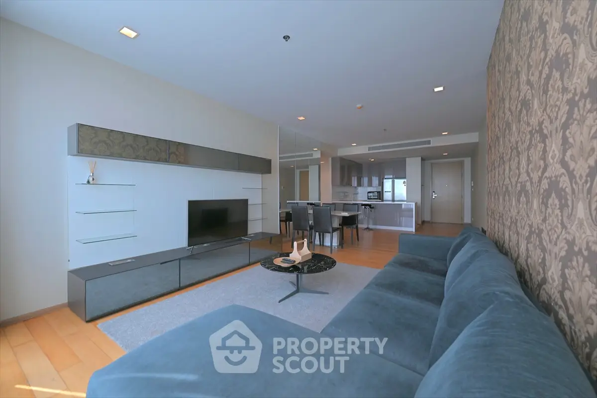 Spacious modern living room with elegant decor and open kitchen layout