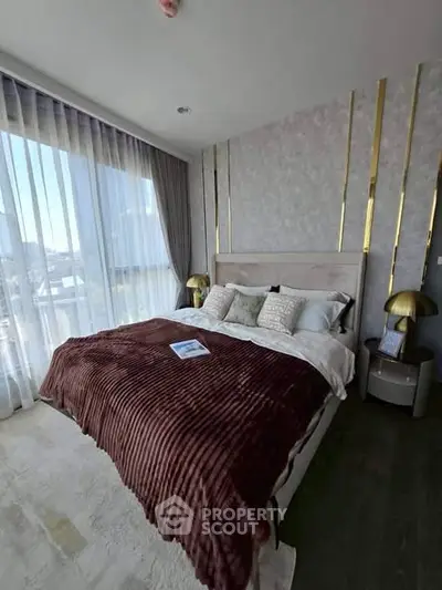 Luxurious bedroom with elegant decor and large window offering stunning views