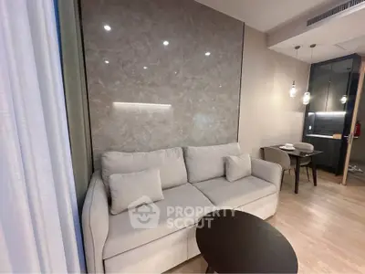 Modern living room with elegant sofa and dining area in stylish apartment
