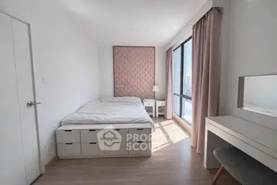 Modern bedroom with stylish decor and ample natural light