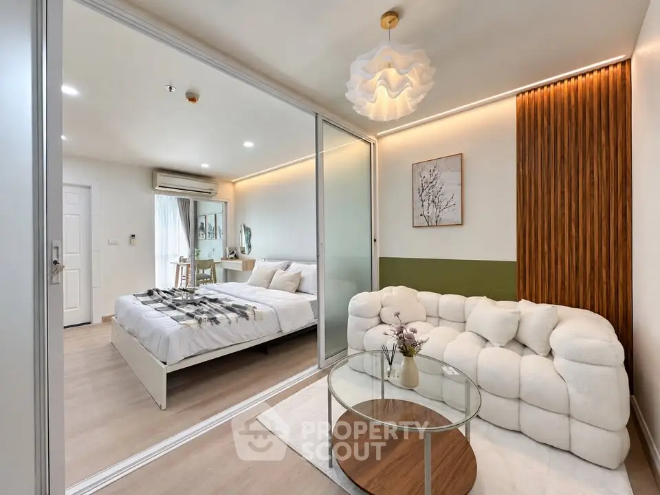Modern bedroom with stylish decor and cozy seating area