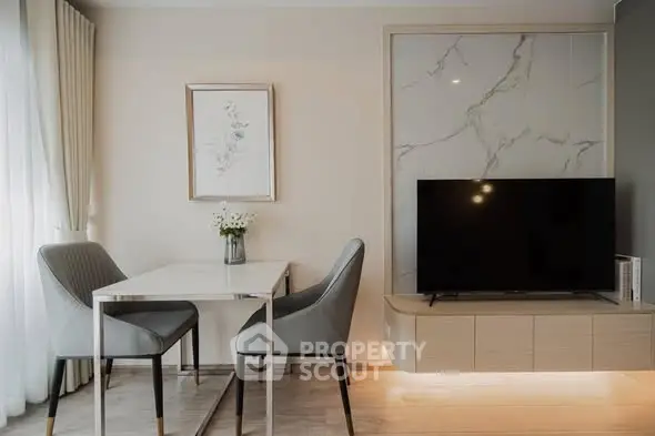 Modern living room with elegant dining area and stylish TV setup