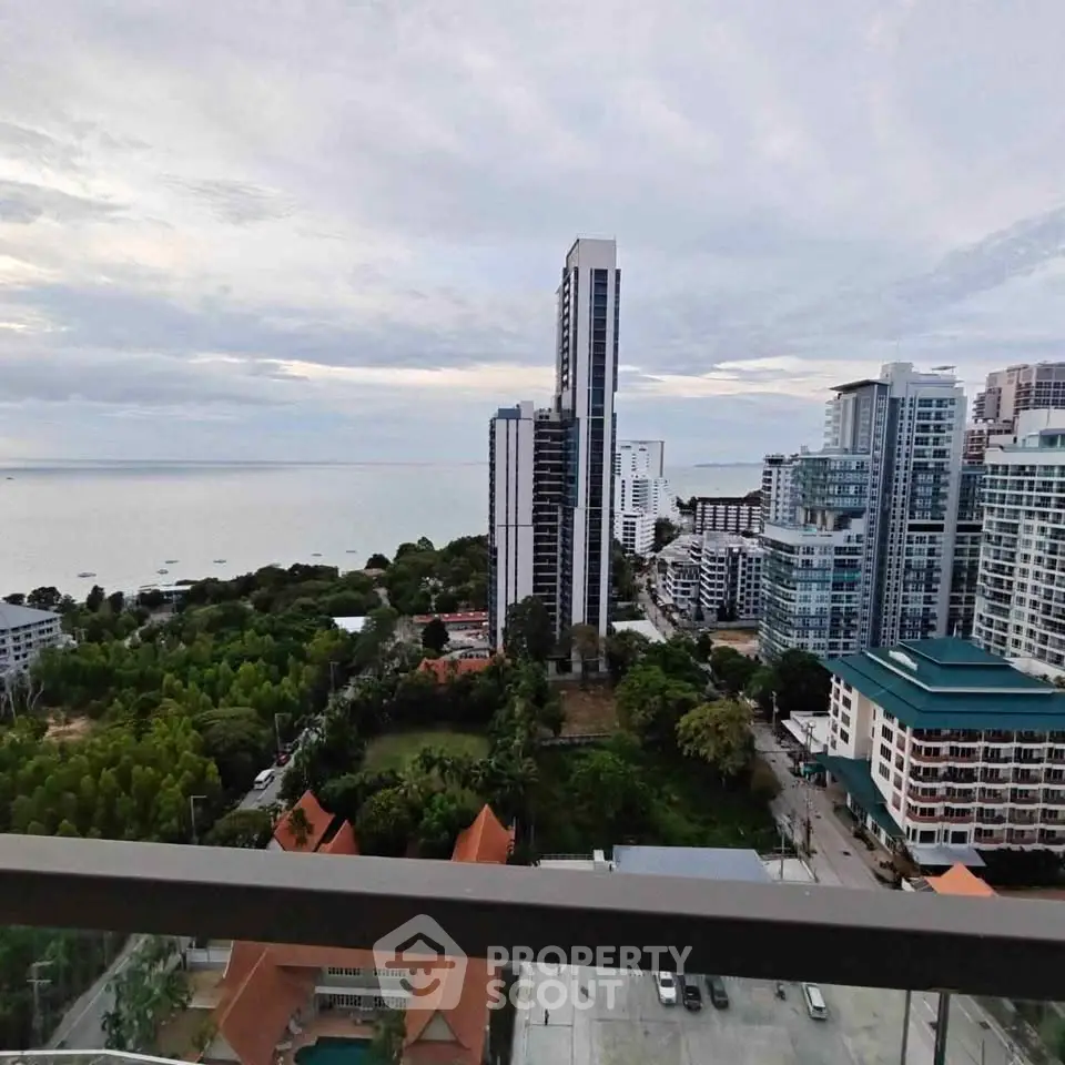 Stunning high-rise view of coastal cityscape with ocean backdrop, perfect for urban living enthusiasts.