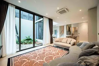 Luxurious modern living room with large windows and stylish decor