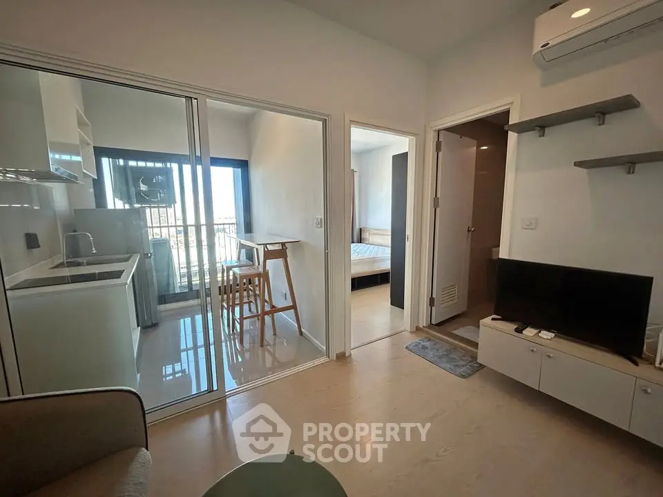 Modern apartment interior with open kitchen and cozy living area