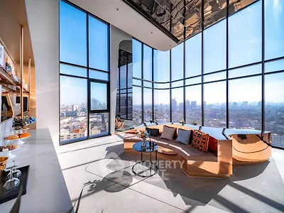 Luxurious high-rise living room with panoramic city views and modern decor