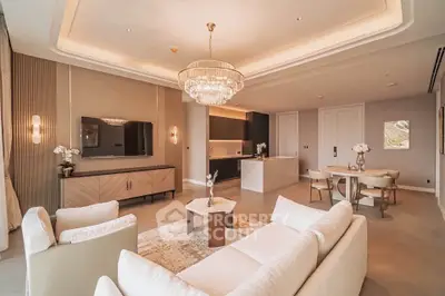 Luxurious open-plan living room with elegant chandelier and modern furnishings
