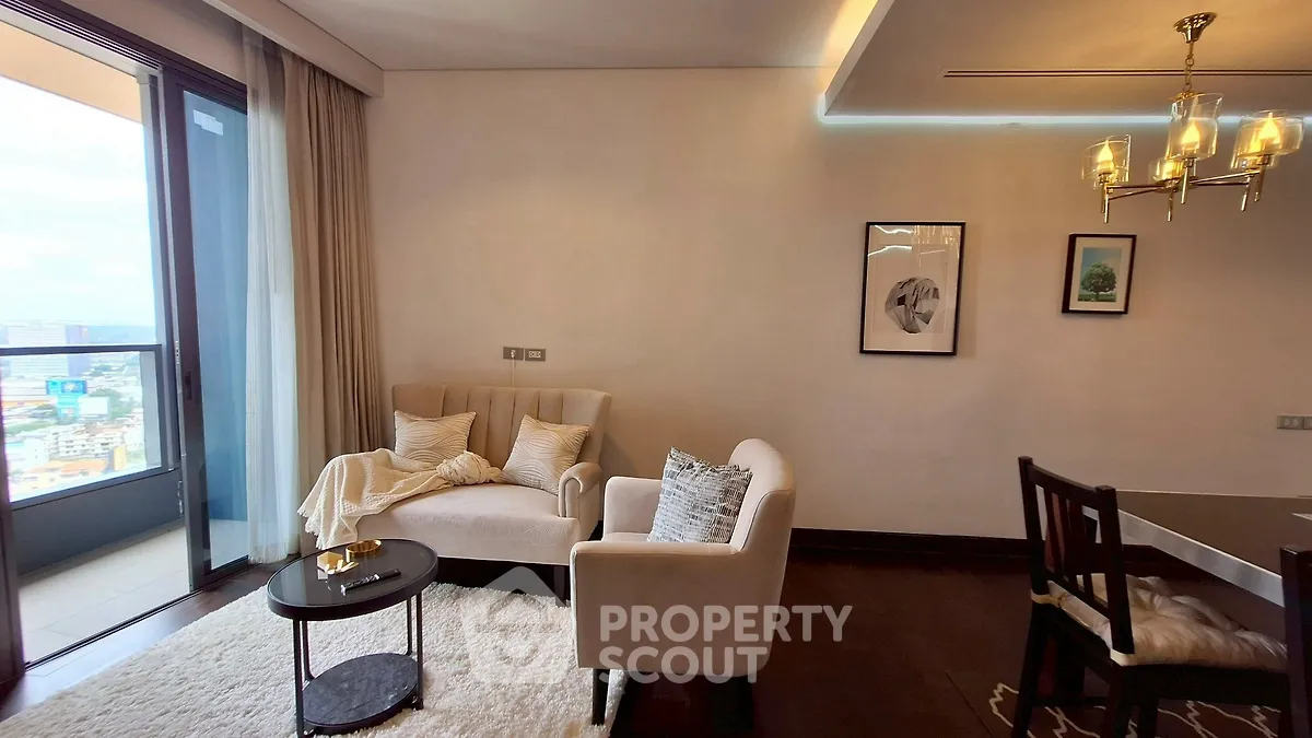 Stylish living room with elegant decor and city view balcony