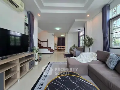 Spacious modern living room with stylish decor and natural light