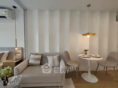 Modern living room with cozy sofa and dining area in stylish apartment