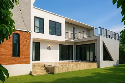 Modern two-story house with spacious balcony and lush green lawn