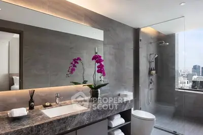 Luxurious modern bathroom with city view, featuring elegant marble countertop and glass shower enclosure.