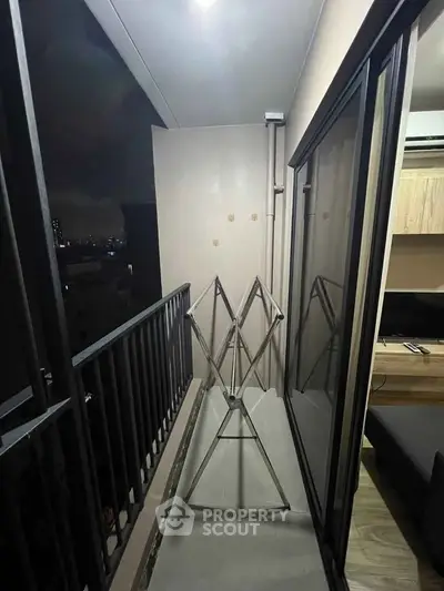 Cozy balcony with city view, perfect for relaxing evenings.