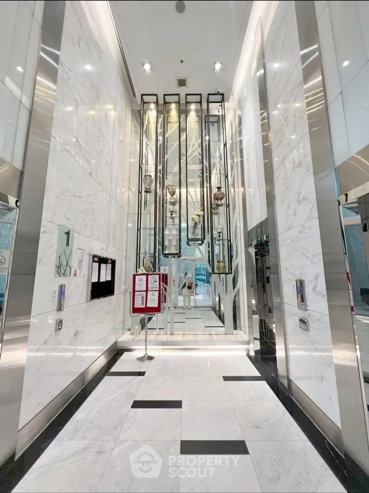 Luxurious marble elevator lobby with modern design and elegant lighting