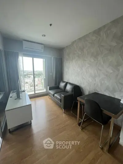 Modern living room with city view, sleek furniture, and stylish decor