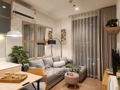 Cozy modern living room with stylish decor and large window view