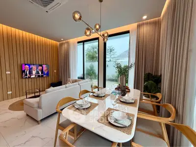 Modern living room with elegant dining area and large windows