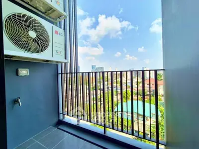 Stunning balcony view with cityscape and blue sky, perfect for relaxation and enjoying urban living.