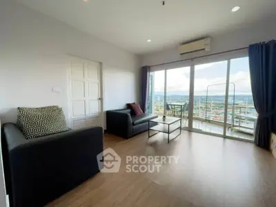 Spacious living room with stunning city view and modern furnishings.