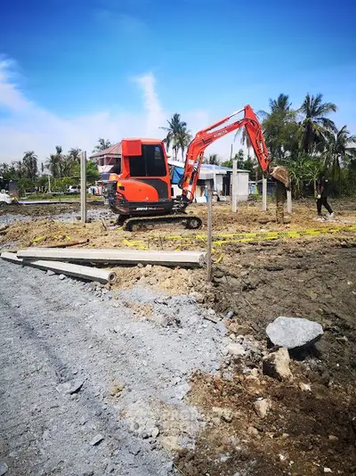 Construction site with excavator preparing land for new development