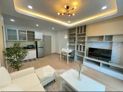 Modern open-plan living room with stylish kitchen and elegant decor