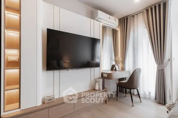 Modern living room with wall-mounted TV and stylish decor