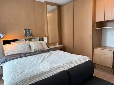 Cozy modern bedroom with wooden accents and ample storage space