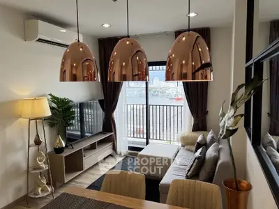 Modern living room with stylish lighting and balcony view