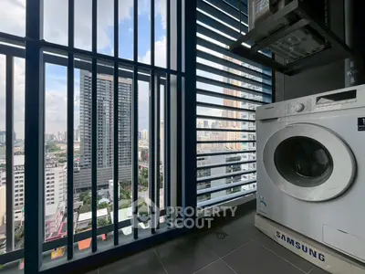 Modern apartment balcony with city view and washing machine