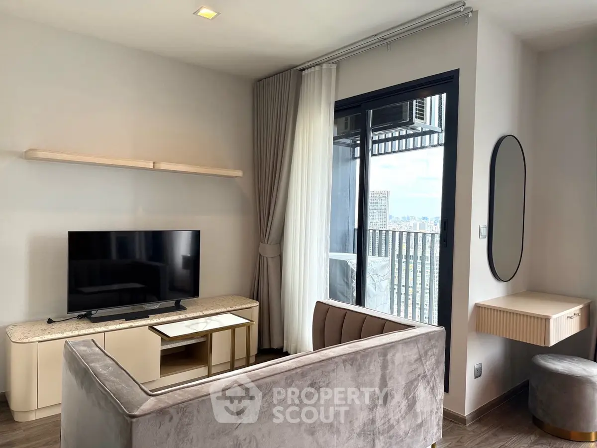 Modern living room with sleek furniture and balcony view in a stylish apartment.