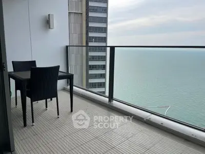 Stunning balcony with ocean view in modern high-rise apartment