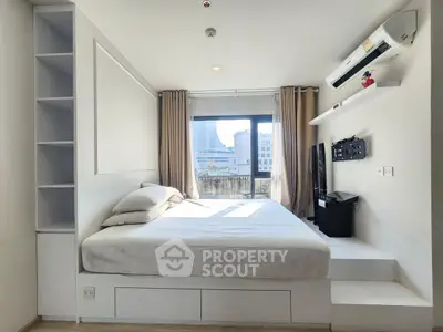 Modern bedroom with city view, built-in storage, and air conditioning