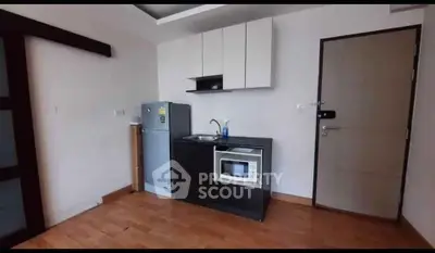 Compact kitchen with modern appliances in a cozy apartment